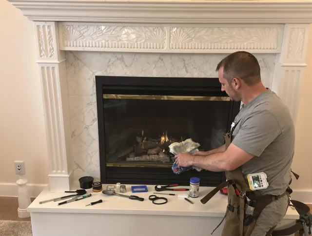 Vernon Chimney Sweep performing fireplace maintenance in Vernon, CT