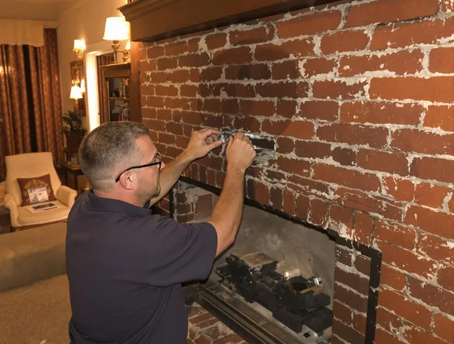 Vernon Chimney Sweep expert fixing a fireplace in Vernon, CT